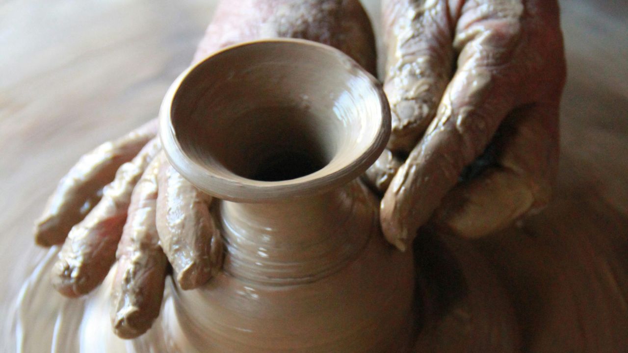 Pottery tools and wet clay prepared for a Hoi An pottery class