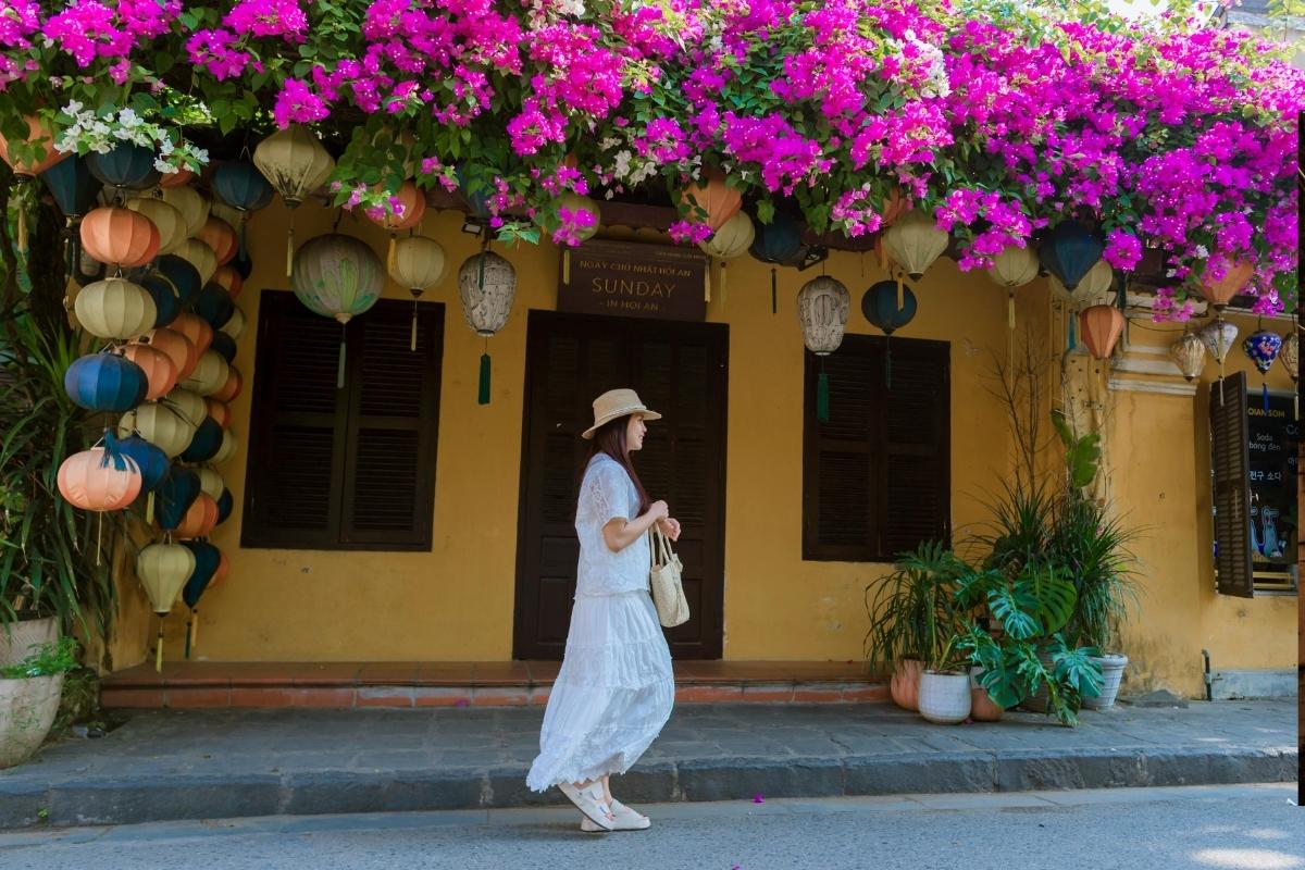 Delightful Woman Walk through Hoi An Old Town